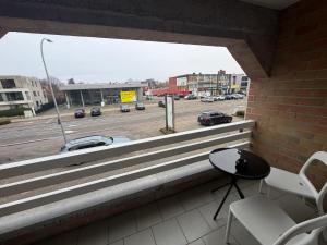 a balcony with stairs and a view of a street at businessflat mol center in Mol