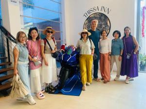 a group of people posing for a picture in a building at Thissa Inn Hotel in Tissamaharama +27 photos