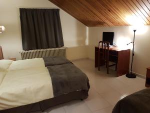 Postel nebo postele na pokoji v ubytování Hotel Guineu + 37 fotografií