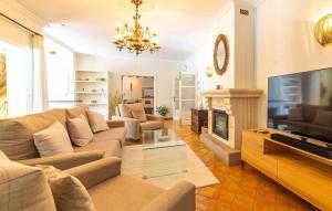 a living room with a couch and a fireplace at Casa Maria in Santa Maria del Camí