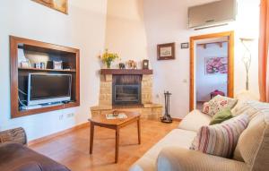 a living room with a couch and a fireplace at Ca Na Conceda in Alcudia +29 photos