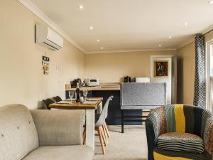 a living room with a table and chairs at The Stables in Edmondsham