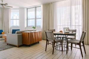 a living room with a table and chairs and a couch at Circ Hotel in Hollywood +64 photos