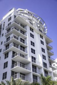 a white apartment building with a dome on it at Circ Hotel in Hollywood