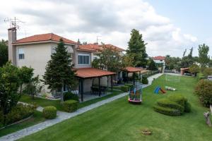 an image of a yard with a playground at Cookoo Villas in Kriopigi