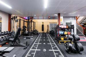 a gym with weights and equipment in a room at Gate of Lapland in Ylitornio