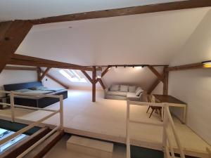 an overhead view of a room with a bed and a couch at Loft zum alten Kraftwerk in Herzogenburg