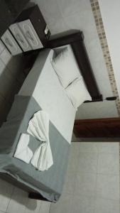 a depiction of a bed in a room at Hotel Plaza Lampião in Serra Talhada