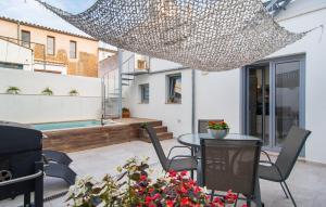a view of a patio with a table and chairs at Petit Arta - Sa Botigueta in Artá