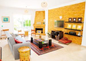 a living room with a couch and a table at Villa Cyprium in Kyrenia +13 photos