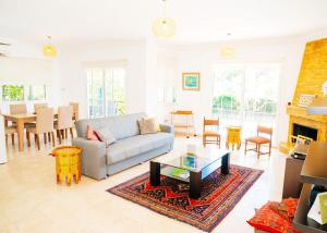 a living room with a couch and a table at Villa Cyprium in Kyrenia