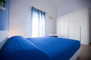Posteľ alebo postele v izbe v ubytovaní Appartamento Nettuno