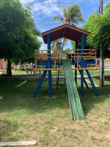 a playground with a gazebo in a park at Apartamento térreo no Morro Branco Marina II in Beberibe