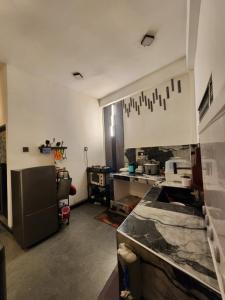 a kitchen with a counter top in a room at HA Homes in Matale