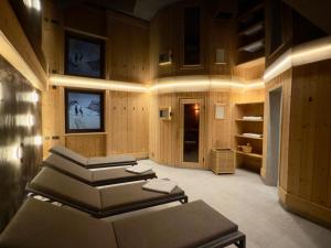 a salon with a bunch of chairs in a room at Residence Untermoarhof in Brunico