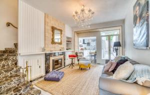 a living room with a couch and a fireplace at Ca Sa Batlessa in Artá
