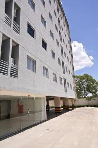 a large gray building with a lot of windows at Nobile Stays Ininga in Teresina
