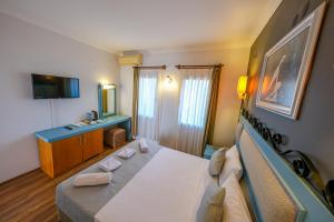 TV a/nebo společenská místnost v ubytování Hotel Atrium