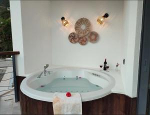 a bathroom with a bath tub with a towel at Villa Ship Ahoy in Kaş +15 photos