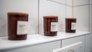 three bottles of honey sitting on a shelf at FlexHome Stadtnatur Ferienwohnung in Lippstadt