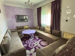a living room with a couch and a table at Casandalus in Larache