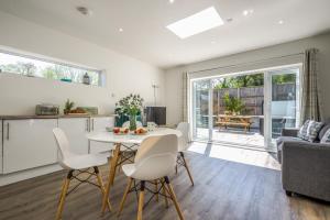 a kitchen and living room with a table and chairs at 2 Bed in Bush oc-h31844 in Bude