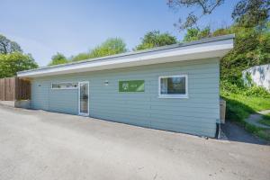 a garage with a sign that reads at 2 Bed in Bush oc-h31844 in Bude