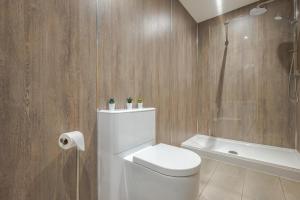 a bathroom with a white toilet and a shower at 2 Bed in Bush oc-h31844 in Bude +18 photos
