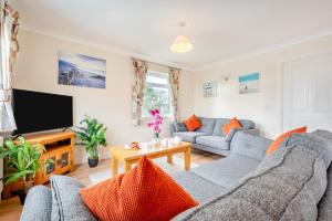 a living room with a couch and a tv at 3 Bed in St. Merryn oc-r30137 in Saint Merryn