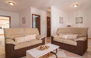 a living room with a couch and a table at Roser De Arta in Artá