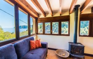 a living room with a couch and a wood stove at Antonio in Deia