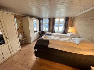 a bedroom with a large bed in a room at Oanes House in Forsand