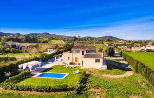an aerial view of a house with a swimming pool at Finca Llum in Manacor +44 photos