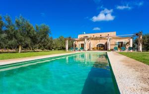 a swimming pool in front of a house at Ses Fonolleres in Son Servera