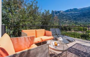 a patio with a table and chairs on a balcony at Arbona Soller in Sóller +34 photos