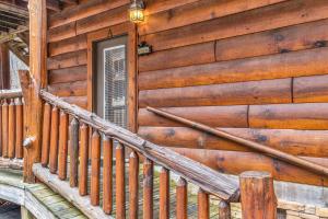 a stairwell of a wooden house with a door at Riverfront Lodge in Tellico Plains +8 photos