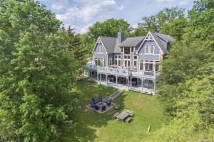 an aerial view of a large blue house at American Eagle Lodge by Railey Vacations in McHenry