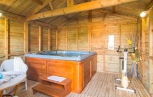 a wooden sauna with a tub in a room at Can Bleio in Pollença