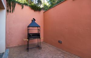 a bird cage sitting next to a wall at Estrella De Son Serra in Son Serra de Marina