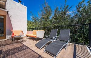 a patio with chairs and a couch on a deck at Arbona Soller in Sóller