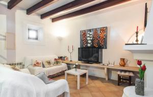a living room with a couch and a fireplace at Sos Monjos in Artá +43 photos