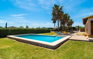 a swimming pool in the yard of a house at Can Jaume Pollenca in Pollença