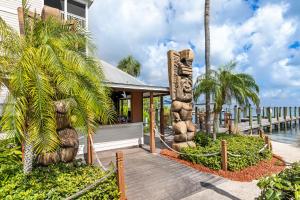 a resort with a totem pole next to the water at Hyatt Vacation Club at Beach House in Key West