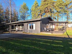 a small house with a porch and a patio at Villa Irjala in Oulu