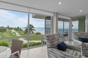 a living room with a view of the ocean at Island Beach Club P4E in Sanibel