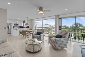 a living room with a couch and chairs and a table at Island Beach Club P4E in Sanibel