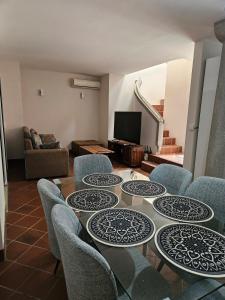 a room with a table and chairs and a television at Riverfront Villa 069 in Terre Rouge