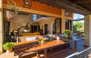 a dining table on a patio in a house at Estrella De Son Serra in Son Serra de Marina