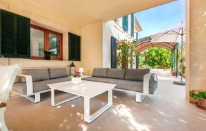 a living room with a couch and a table at Sa Mina De Crestatx in Sa Pobla