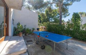 a blue ping pong table on a patio at Amedart in Alcudia